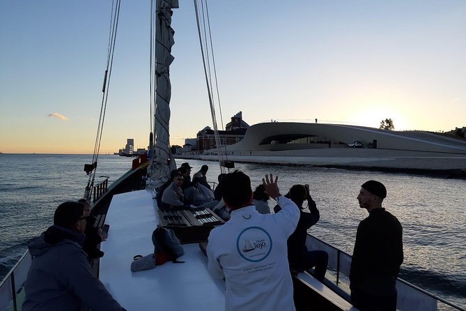 2-Hour Lisbon Traditional Boats Sunset Cruise with White Wine - Wine, seating, and the social mood