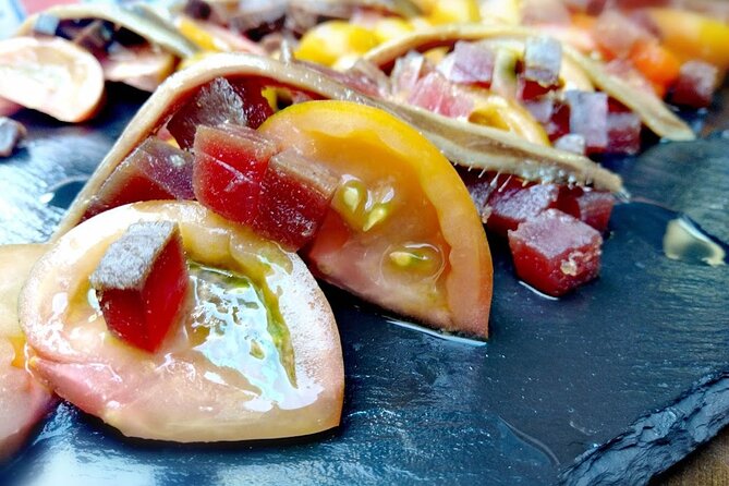 Alicante Wine Tasting and Tapas for Foodies - Award-winning tapas with seafood, peppers, and pork