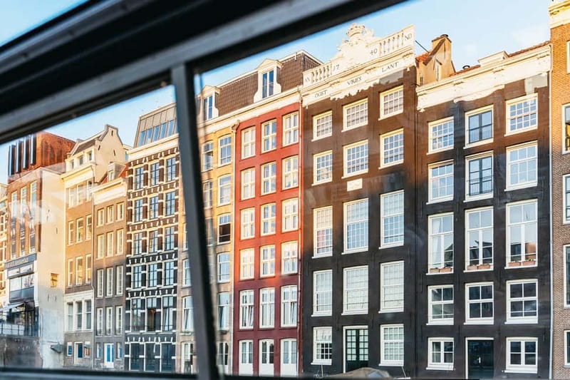 Amsterdam: Cozy Cheese & Wine Cruise Tasting Experience - Dutch cheese, salty snacks, and a steady glass