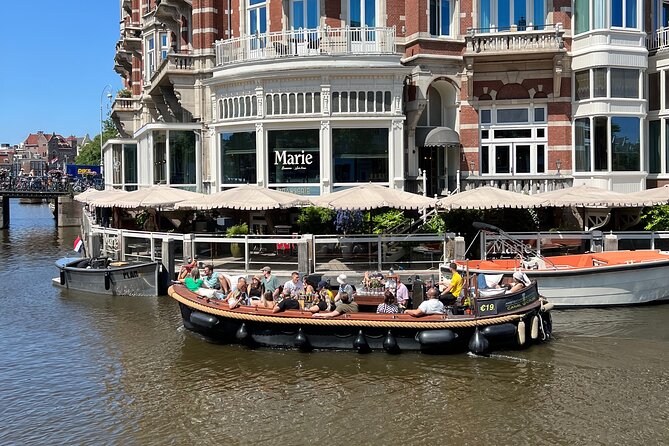 Amsterdam Luxury Boutique Boat tour with Unlimited Beer and Wine - Oude Kerk and the oldest church setting