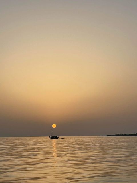 Argostoli: Sunset Cruise with Swim Stops, Dinner, and Wine - Meeting the Queen Bee at Argostoli Harbor