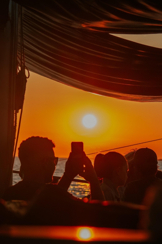 Argostoli: Sunset Cruise with Swim Stops, Dinner, and Wine - Xi Beach and Livadi: red sand or calmer water