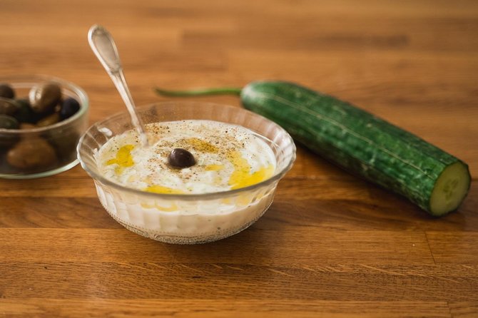 Athens: Classic Cooking Class with Market Visit and Wine - The family-style meal and the social side