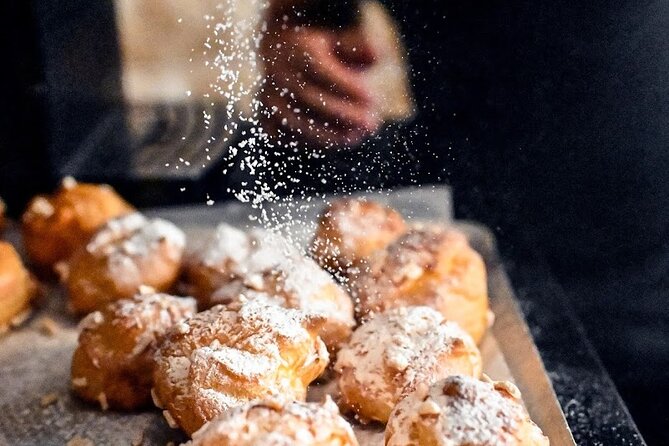 Authentic Parisian Gourmet Food Tour with 10 Local Dishes & Wines - Montmartre: bakery shelves, cheese counters, and old Paris charm