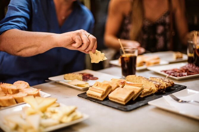 Barcelona Gothic Quarter Tapas & Taverns Food & Wine Tour - Walking past Roman stones and medieval lanes