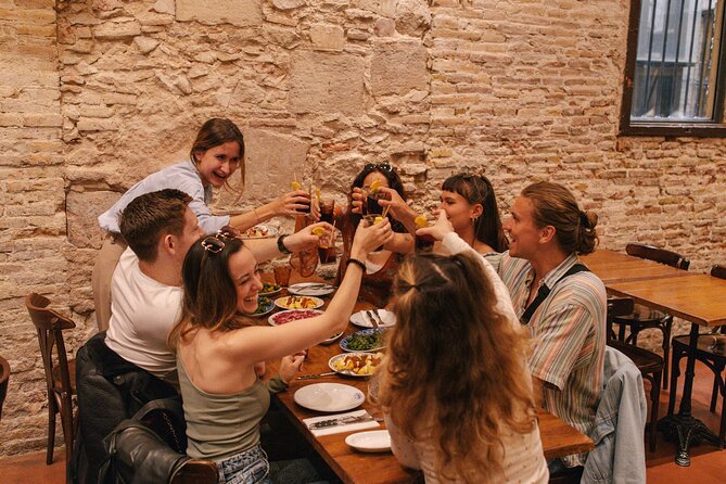 Barcelona: Guided Food Walking Tour with Tapas and Wine - Carrer de la Mercè: an old bodega and the communal porrón