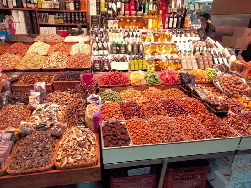Barcelona: Markets Tour With Food and Wine Tasting Upgrade - A caganer shop explains Catalan humor