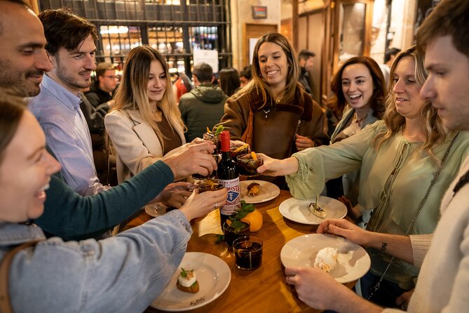 Barcelona Side Streets Tapas & Wine Tour - First stop: Catalan food beside an ancient wall