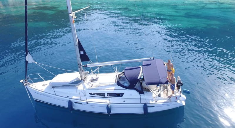 Barcelona: Sunset Boat Trip with Cava Wine and Snacks - Learning to steer the boat