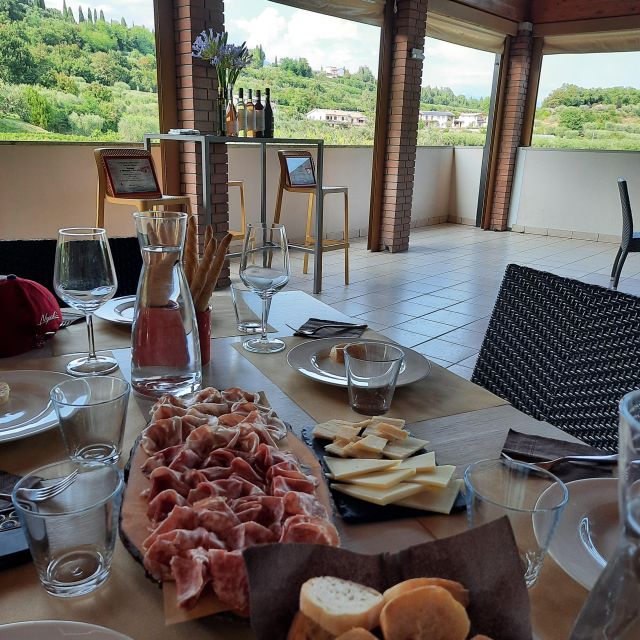 Bardolino: Vineyard Tour with Wine, Olive Oil & Food Tasting - Reaching the winery above Bardolino