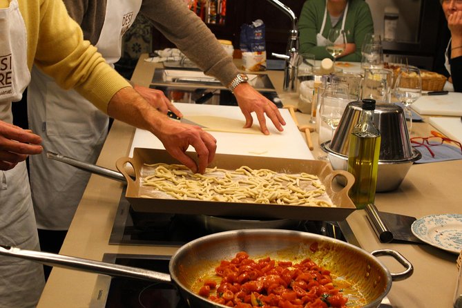 Bari: Home Cooking Class- Make Cavatelli & Capunti with Wine - Shaping pasta in a Bari home