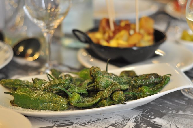 Born to Eat: Gourmet Tapas & Wine Small Group Tour in Old Barcelona - Passeig del Born and the name behind the neighborhood