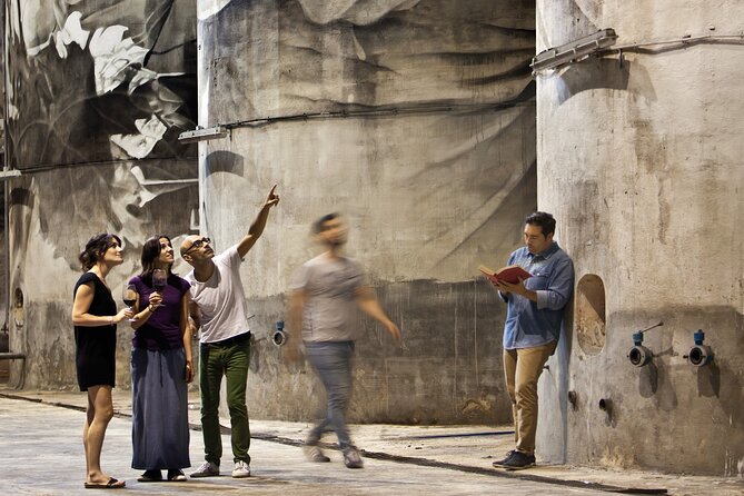 Complete winery experience: visit, tasting and traditional food - The painted concrete tanks by Guido van Helten