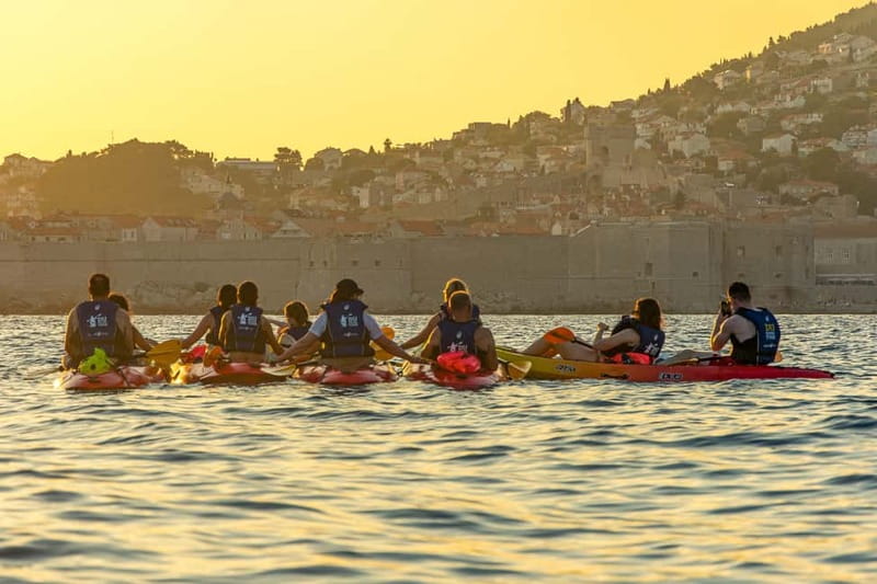 Dubrovnik: Guided Sunset Sea Kayaking Tour with Wine - Paddling below Dubrovnik’s famous walls