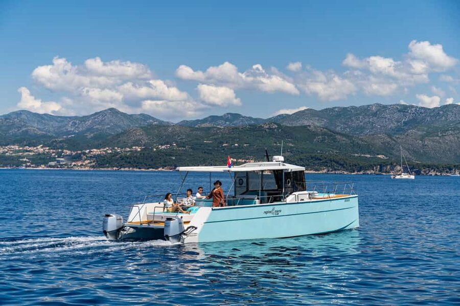 Dubrovnik: Sunset Catamaran Cruise with Sparkling Wine - Leaving Dubrovnik beside the city walls