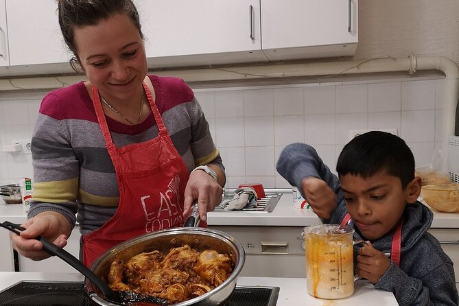 Easy Cooking Class Budapest - with Market Walk (local wine & pálinka included) - Cooking chicken paprikás, nokedli, and stuffed cabbage