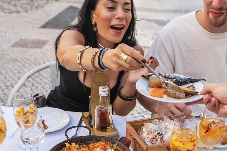 Eat & Walk Through Lisbon: A Local Food & Wine Experience - A guide-led walk, not a restaurant crawl on autopilot