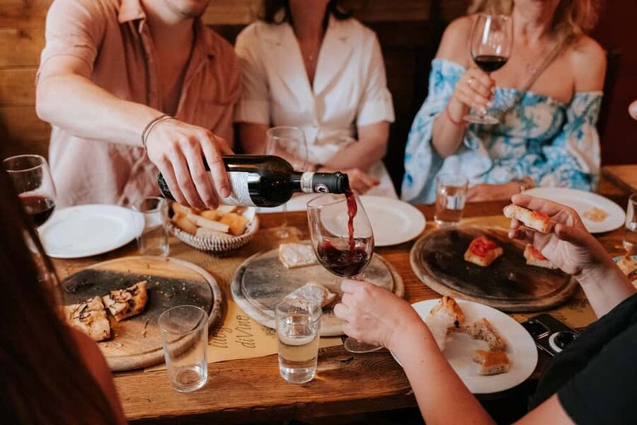 Florence: Small-Group Sunset Food & Wine Tour in Oltrarno - I’ Vinaino di San Frediano adds a neighborhood wine-shop feel