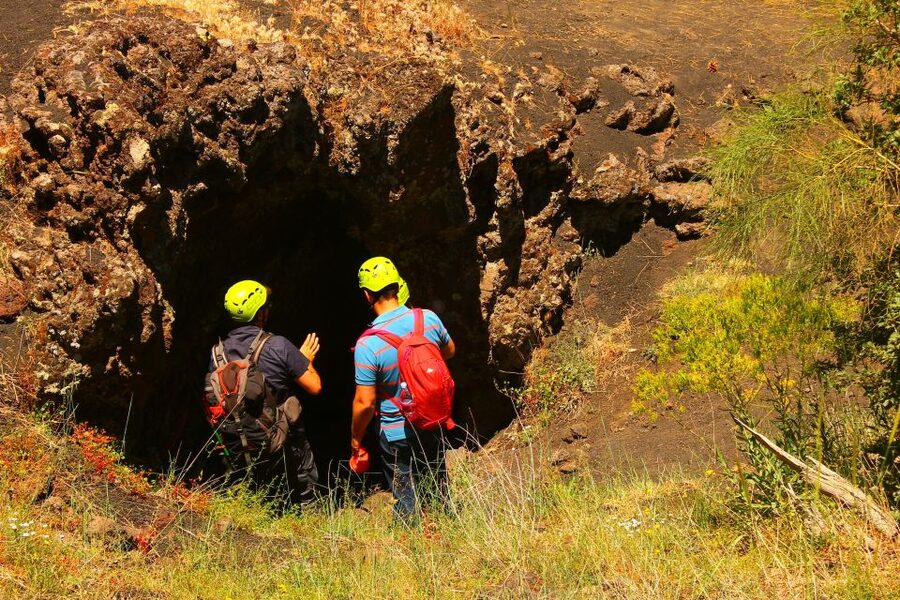 From Catania: Mt. Etna, Wine and Alcantara Tour - Entering an Etna lava cave with helmet and lamp