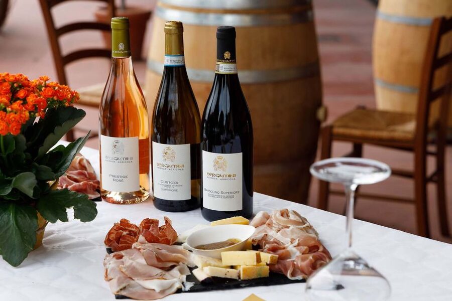 Lazise: Winery Tour with Garda Wines and Food Tasting - Finding the striped red and yellow facade