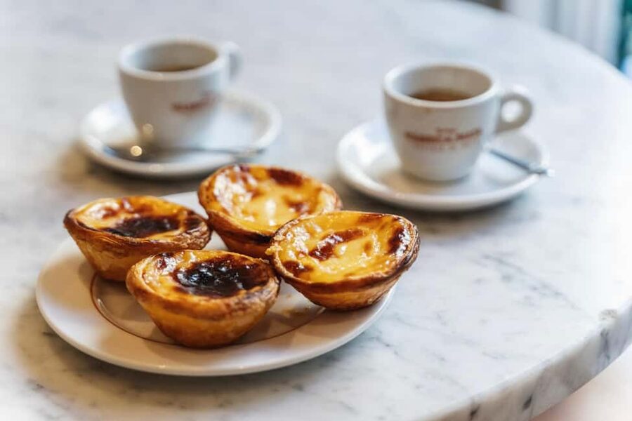 Lisbon: Food & Wine Walking Tour Through Baixa - Rua da Vitória: petiscos, seafood, and the social table