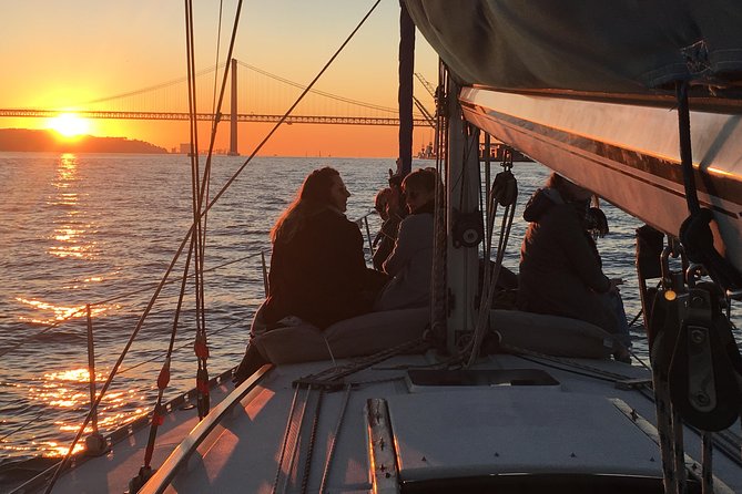 Lisbon Sunset Sailing Tour with White or Rosé Wine and Snacks - Passing beneath the 25 de Abril Bridge