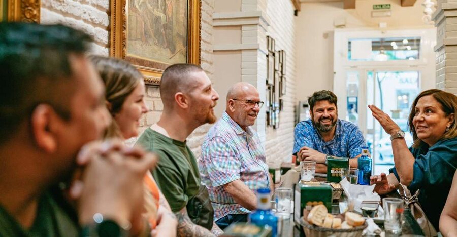 Madrid: Food & Wine Tour with 10 Tapas & 4 Drinks Included - Four local stops, four drinks, and plenty to eat