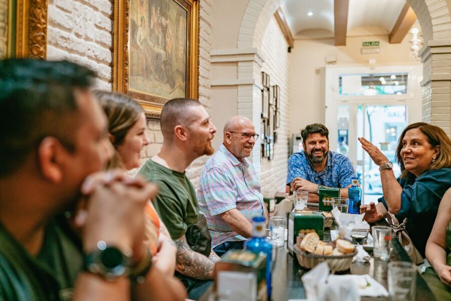 Madrid: Food & Wine Tour with 10 Tapas & 4 Drinks Included - Stop two: a neighborhood bar with a local feel