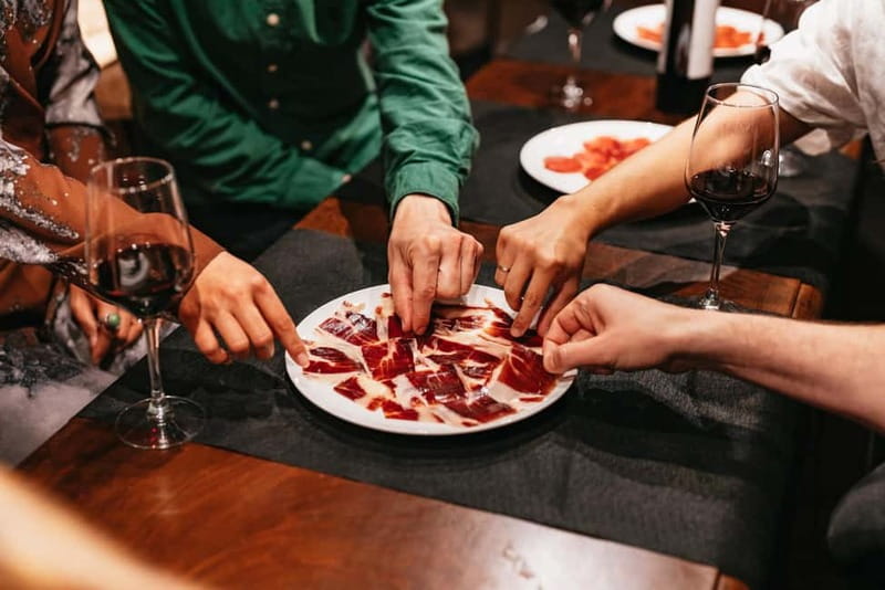 Madrid: Guided Tapas and Wine Tour with Rooftop Views - Beef Cheeks and a Traditional Casa de Comidas