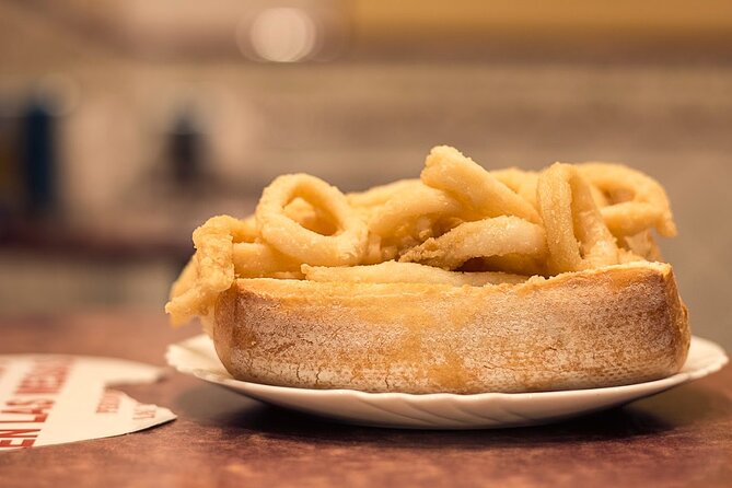 Madrid Historic Centre Food Tour with Authentic Tapas & Wines - The famous fried squid sandwich