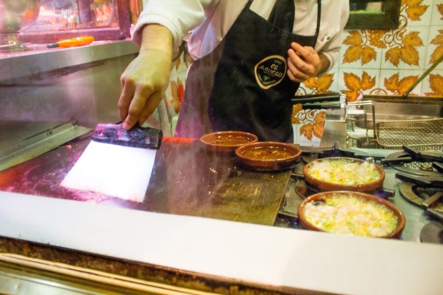 Madrid: Tapas & Wine Tasting Tour with Local Guide - Stop three: More tapas, more conversation