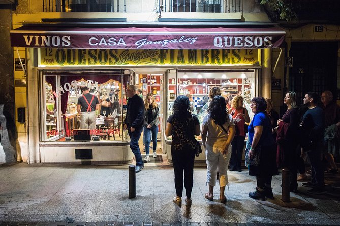 Madrid Tapas & Wine Tasting Walking Tour – Small Group Local Bars - Stop two: a wine shop hidden behind bottles