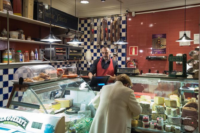 Madrid Tapas & Wine Tasting Walking Tour – Small Group Local Bars - Stop three: an open kitchen on Calle de la Cruz