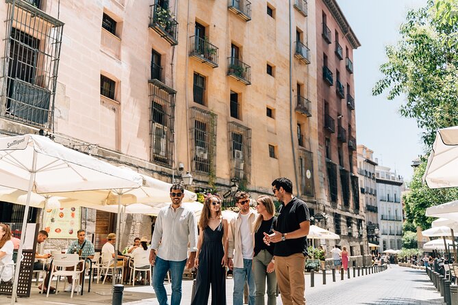 Madrid Tapas & Wine Tour with Rooftop Views and Local Guide - Santa Ana and garlic shrimp in clay