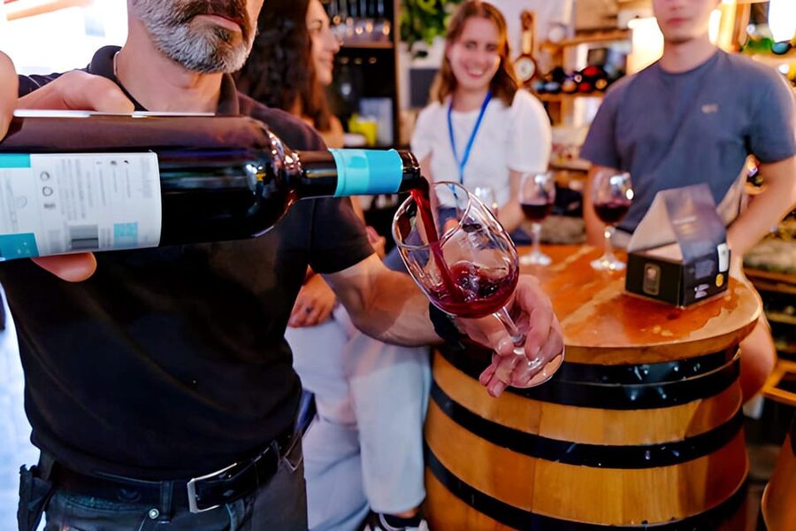 Malaga: Wine and Tapas Tour with Tastings and Drinks - First stop: tapas with a lesson in Malaga food