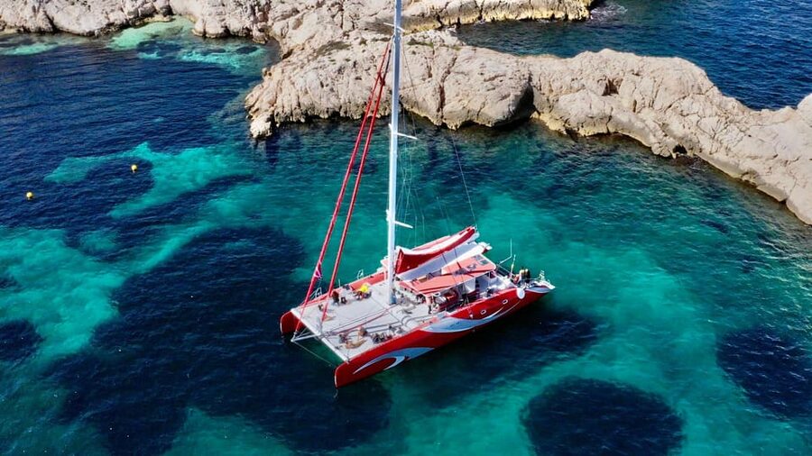 Marseille : Calanques Catamaran Cruise with Lunch & Wine - Sormiou, with cliffs close to the boat