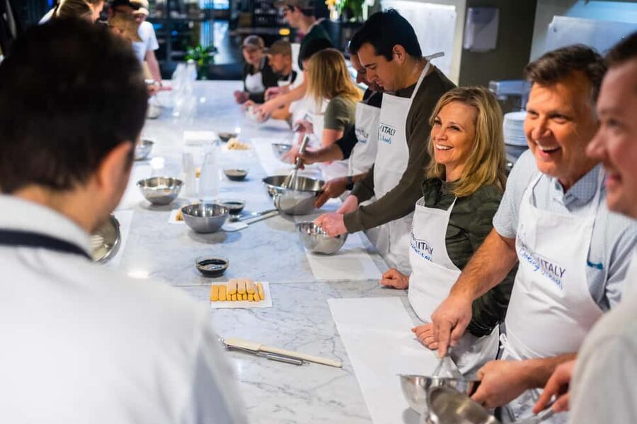 Milan: Pasta Class with Gelato or Tiramisù & Unlimited Wine - Making pasta near Milano Centrale