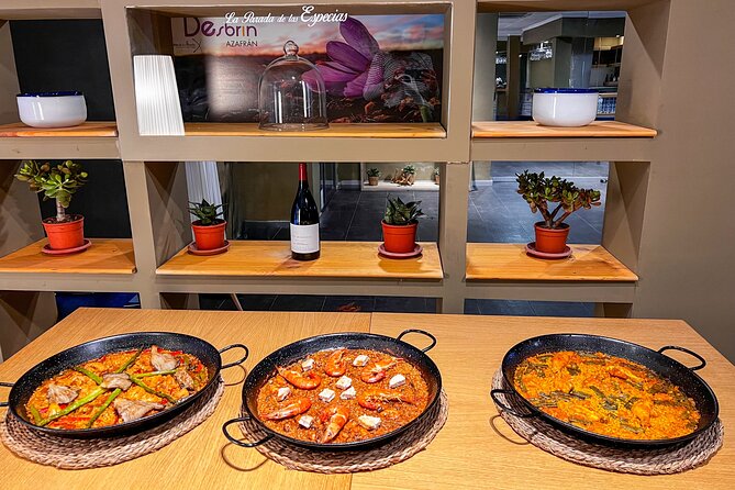Paella Cooking Class, Wine Tasting & Central Market in Valencia - Tapas, wine, and the meal at the table