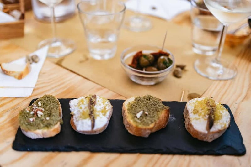 Palermo: Wine Tasting with Snacks at Bottega Monteleone - The hosts make the evening work