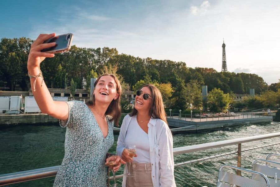 Paris: Seine River Cruise with Champagne from Eiffel Tower - A quiet ride beneath Paris bridges