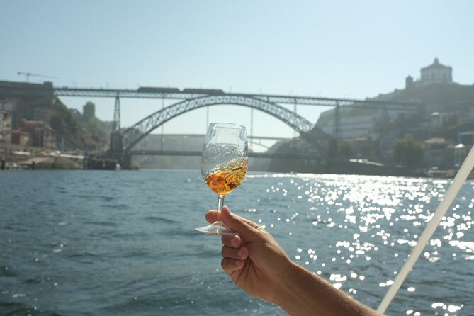 Porto: Douro River Boat Cruise with Port Wine and Snacks - Porto’s oldest bridge and the 1881 city icon