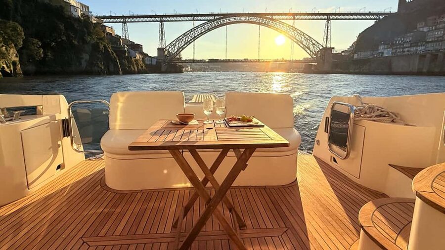 Porto: Luxury 6 Bridges Yacht Cruise with Wine & Snacks - Ribeira and Gaia with wine in hand
