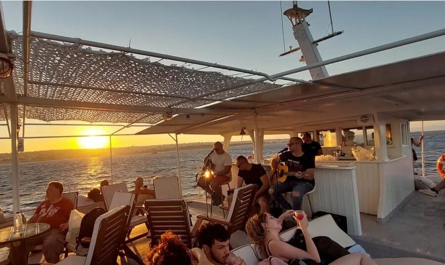 Rhodes: Sunset Cruise with Live Music, Wine & Greek Buffet - Greek dinner, local wine, and a simple buffet