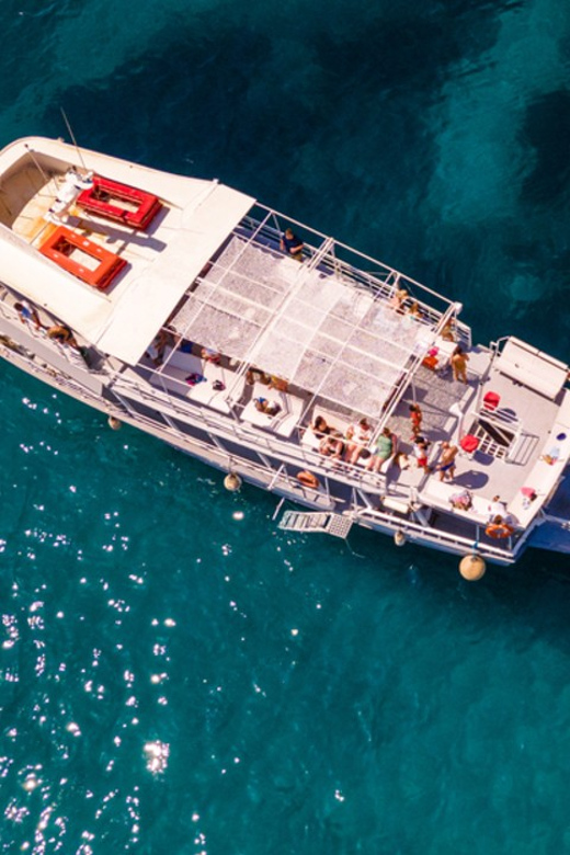 Rhodes: Sunset Cruise with Live Music, Wine & Greek Buffet - Guitar music turns the return trip into a party