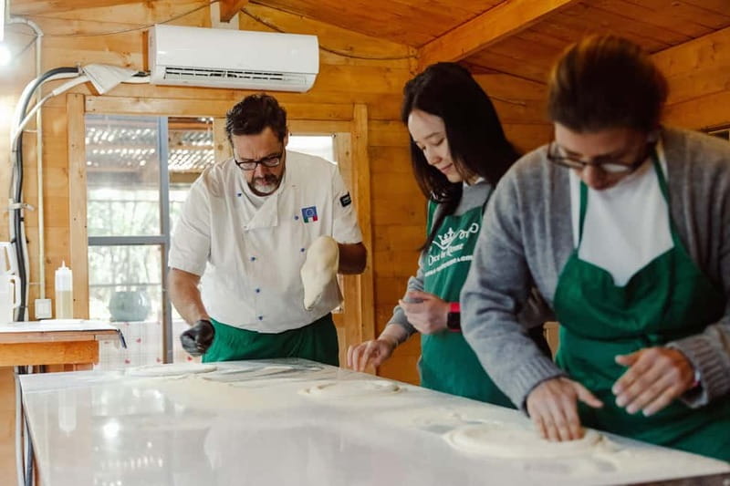 Rome: Combo Pizza and Pasta Cooking Class with Wine - Making Neapolitan pizza in a wood-fired oven