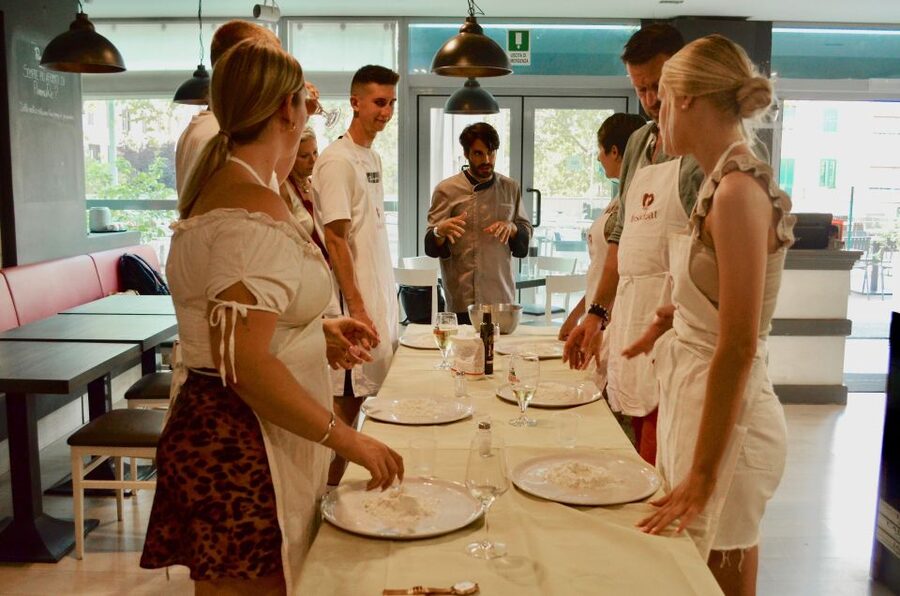 Rome: Hands-On Pizza Making Class near the Vatican with Wine - Shaping a Roman-style pizza