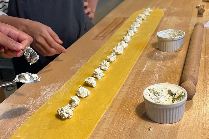 Rome Pasta Making Class with Italian Sauces and Wine Included - Sitting down to eat what you made