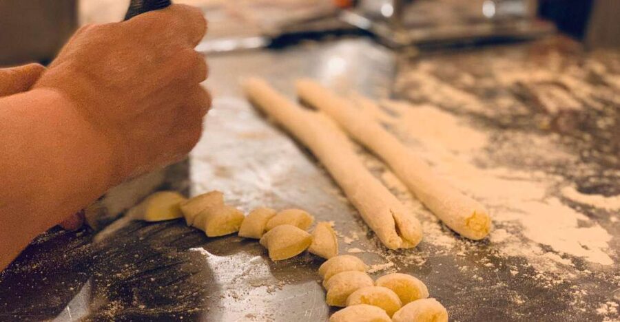 Rome: Pasta & Tiramisu Class with Free Flowing Fine Wine - Rolling pasta dough with an instructor