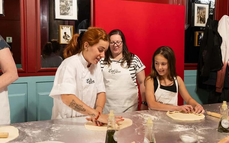 Rome: Pizza and Tiramisù Cooking Class with Glass of Wine - Sitting down to eat what you made