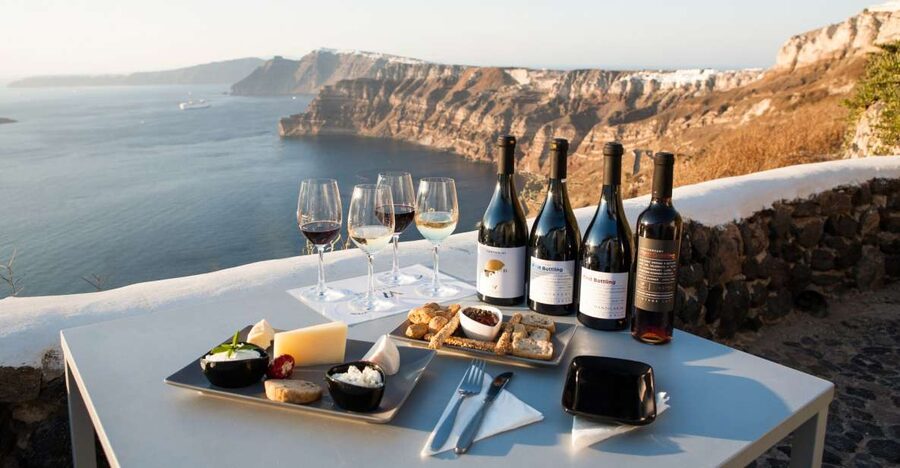 Santorini: Three Wineries and One Brewery Tour with Tastings - Art Space Winery, wine in an old cellar and art setting